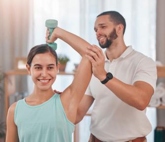 woman receiving physical therapy for shoulder injury