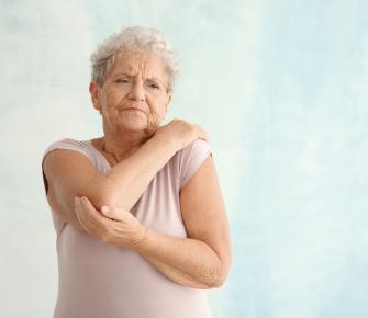 Senior woman with elbow pain